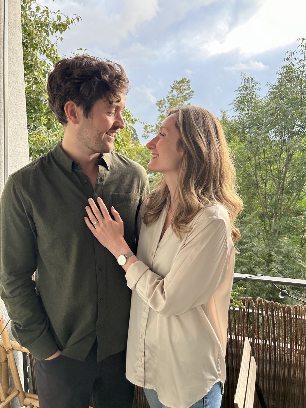Amanda and Calum smiling together after getting engaged